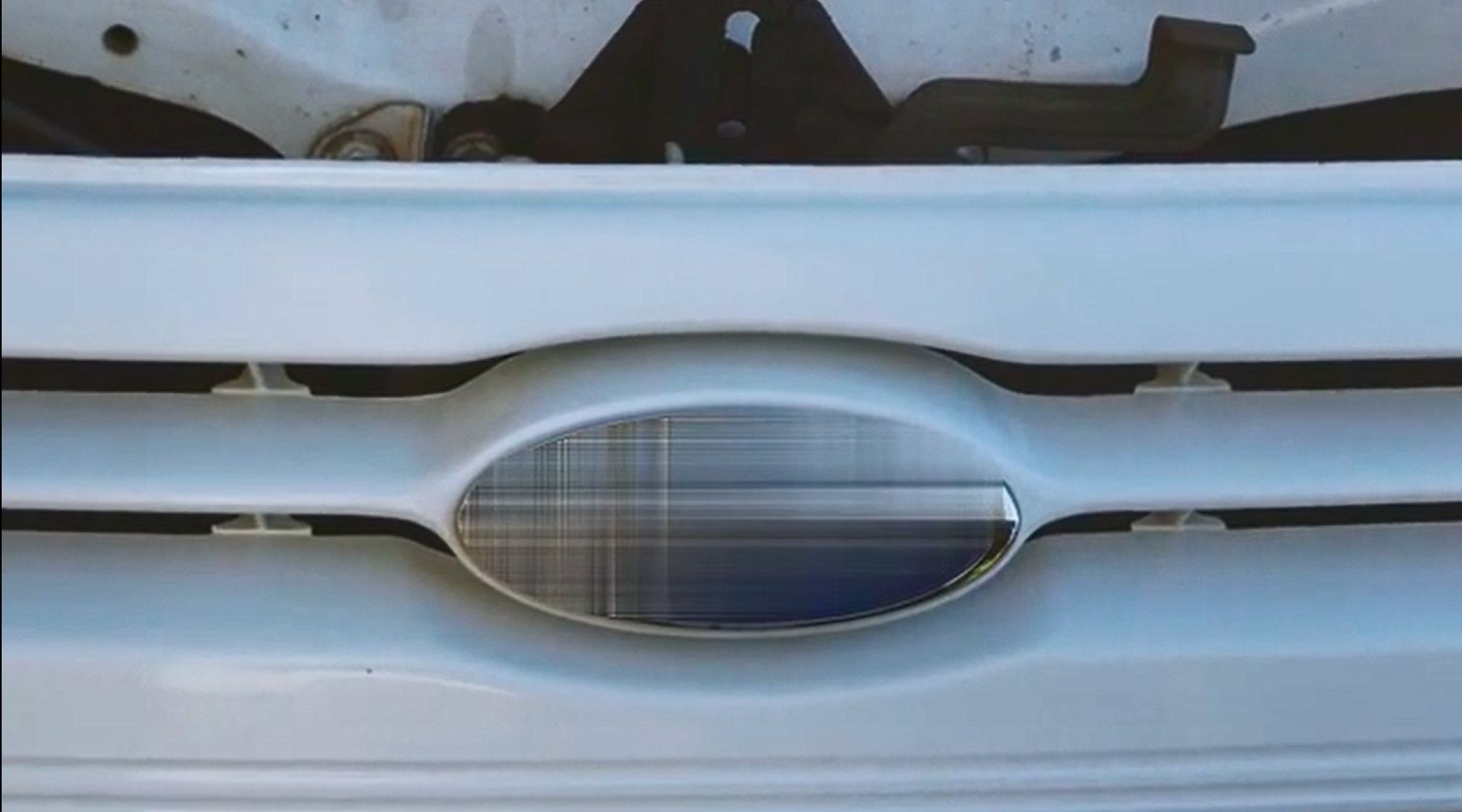 Blurred Ford logo..