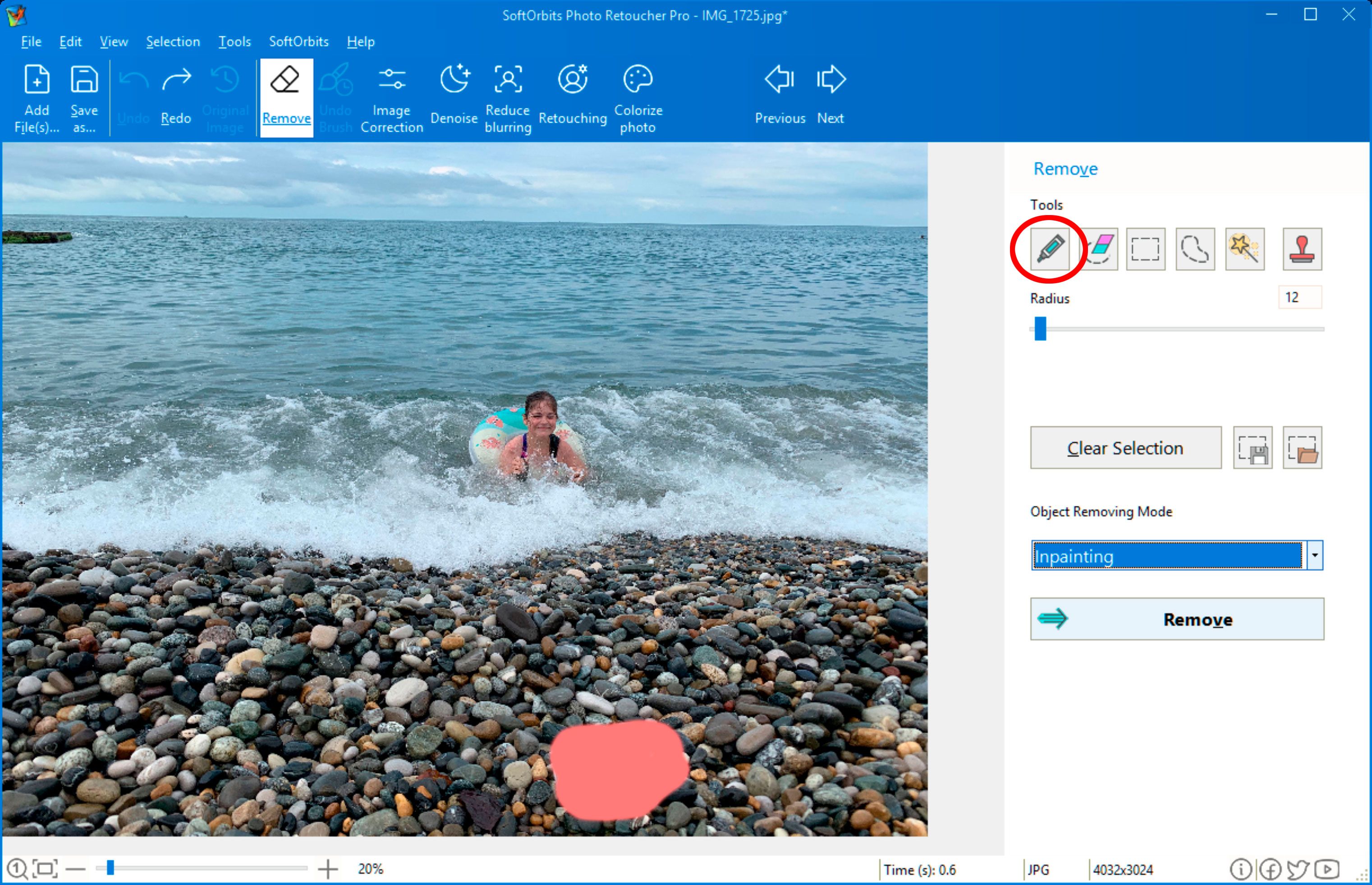 Remove object from a photo using Photo Retoucher..