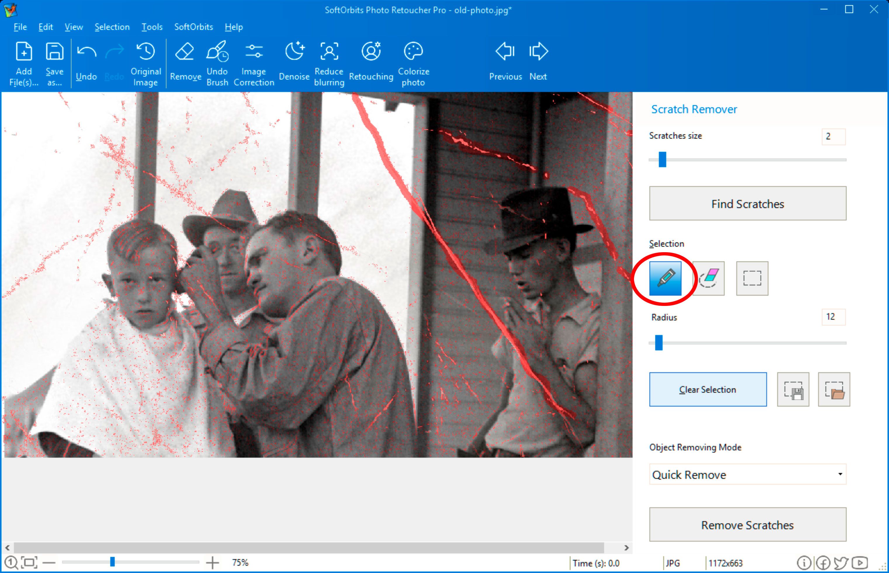 Select scratches manually using Photo Retoucher..