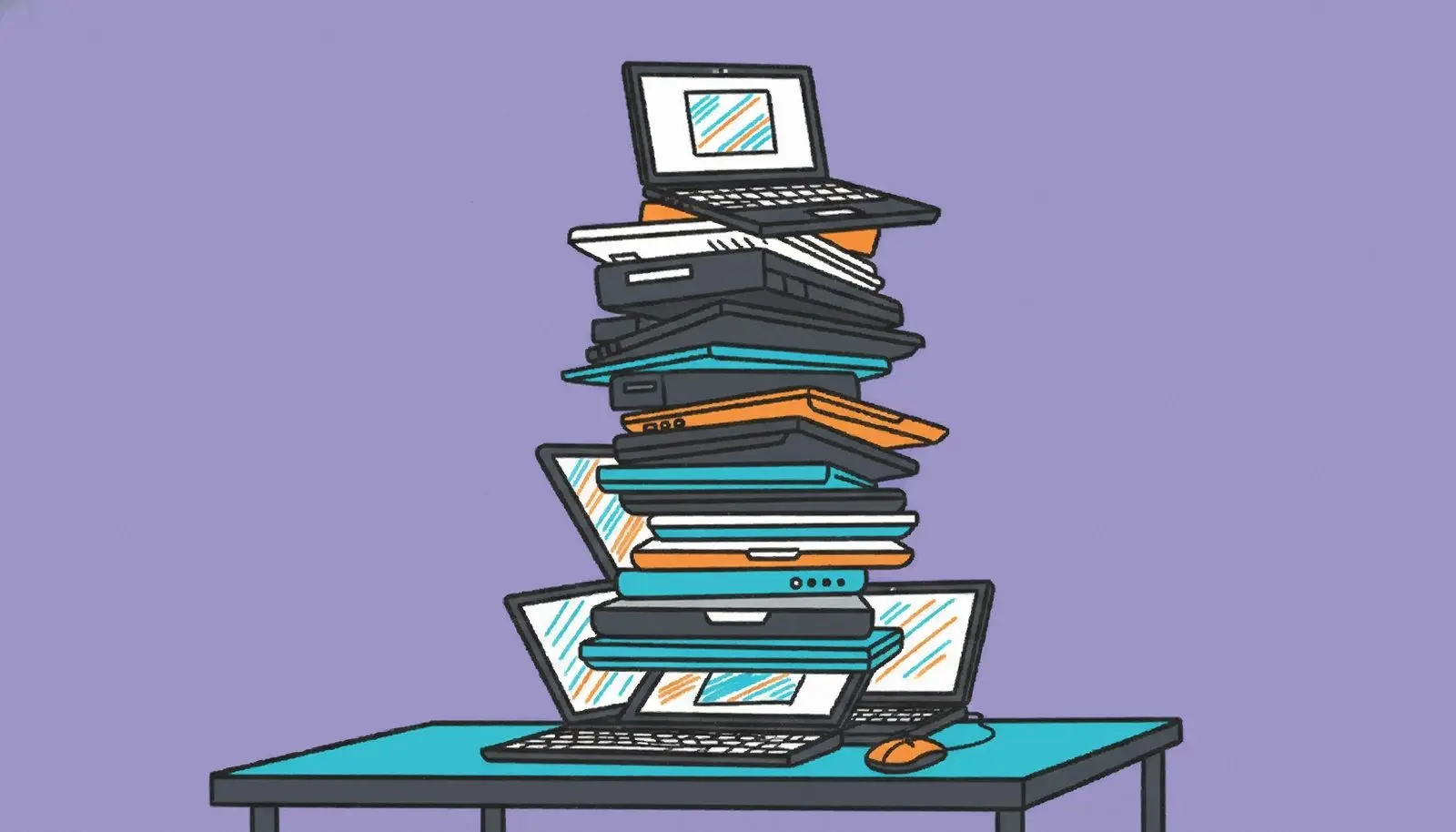 Stack of old laptops on a desk.